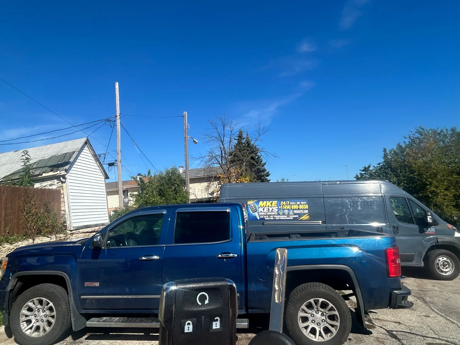 MKE KEYS mobile locksmith service vehicle and customer truck